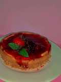 Cheesecake con una compota de fresa y mora