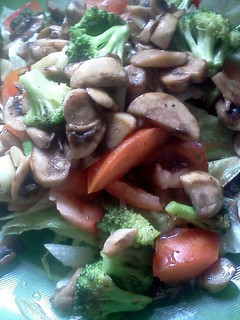 A picture of broccoli & mushroom salad.