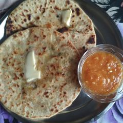 A picture of Aloo ka parontha with kachari ki chutney& butter.