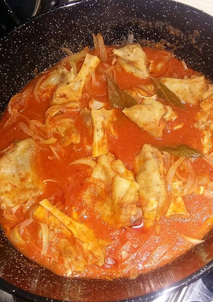 Una foto de Manitas de cerdo en salsa