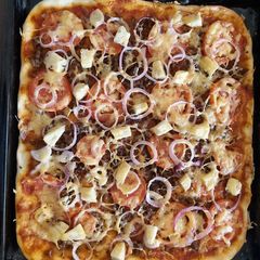 A picture of Home made meat deluxe pizza.