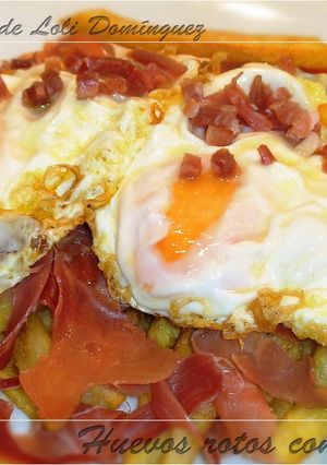 Una foto de Huevos rotos con jamón