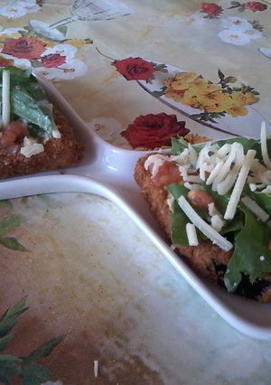 Una foto de Brusqueta de milanesa de berenjena 