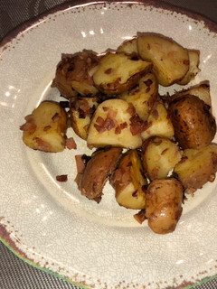 Una foto de Papas al horno con cebolla