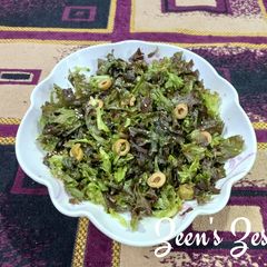 A picture of Lollo Rosso Lettuce and Olive Salad.