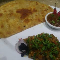 Puri paratha with tikka boti 🍗😋 A picture of Puri paratha with tikka boti 🍗😋.