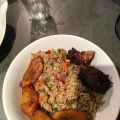 A picture of Vegetable jollof rice and plantain.