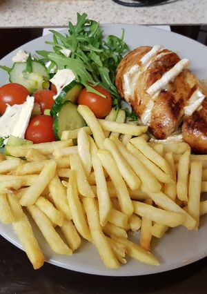 A picture of My Roast Breast of Chicken with Melted brié. With Chips & Salad.
