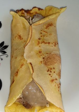 Una foto de Crepa rellena de recalentado de chancho al horno