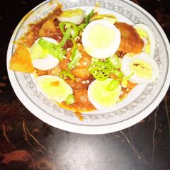 A picture of Dam alo with boiled eggs.