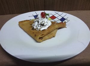 Una foto de Crepas dulces flameadas con salsa de cajeta