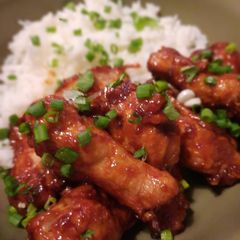 A picture of Crispy chicken wings in sweet and spicy Chinese glaze.