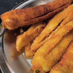 Crispy Eggplant Fries | Baingan Phula Bhaja | Eggplant Flower Fry A picture of Crispy Eggplant Fries | Baingan Phula Bhaja | Eggplant Flower Fry.