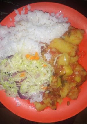 A picture of Rice, Matoke, lemoncabbage.