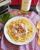 Turkey strips with mushroom and spinach in creamy sauce on a bed of homemade Tagliatelle
