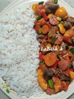 A picture of Fried Plantain with Gizzards and Chicken Franks Sauce.