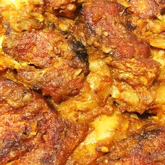 A picture of Bengali style aloo fish curry.