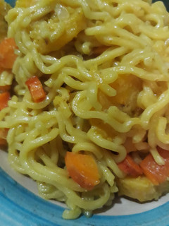 A picture of Noddles with carrots.