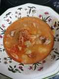 Cerdo guisado con col