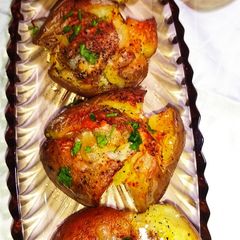 A picture of Cheesy Smashed Potatoes 🥔.