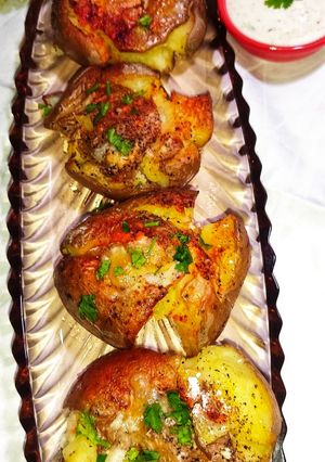 A picture of Cheesy Smashed Potatoes 🥔.