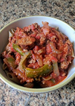 A picture of Sausage and Peppers (Cajun) over Penne.