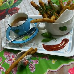 A picture of Crispy potato fingers with green tea.