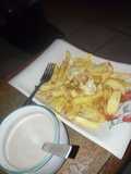 Potato chips and fried egg with tea