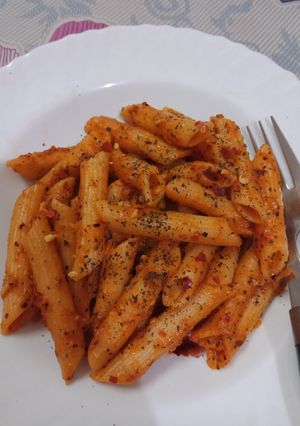 A picture of Penne in red sauce.