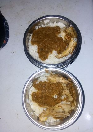 A picture of Rice and stew with chicken.