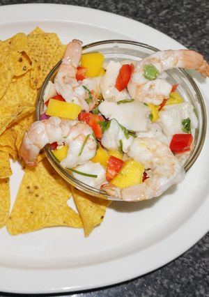 A picture of Ceviche with Abalone, Shrimp, Conger, and Mango.