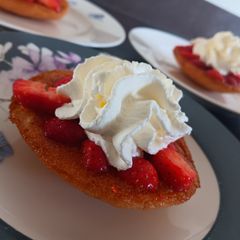 A picture of Egg cake with strawberry's.