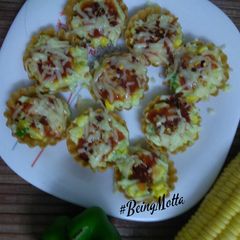 Corn capsicum cheese tarts A picture of Corn capsicum cheese tarts.
