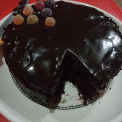 A picture of 3 ingredient cake in sauce..with potatoes triangles full meal.