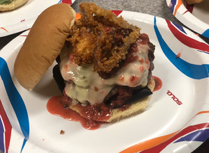 A picture of Creamy Jalapeño Stuffed Burgers with Raspberry Chipotle Sauce.