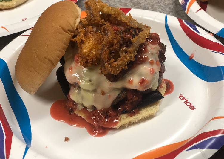 Creamy Jalapeño Stuffed Burgers with Raspberry Chipotle Sauce