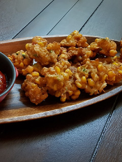 A picture of Shrimps and corn fritters.