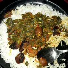 A picture of White rice and efo riro.