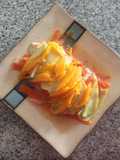 Pescado empapelado con topping de mango