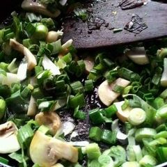 A picture of Mushroom methi and spring onion.