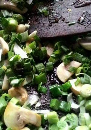 A picture of Mushroom methi and spring onion.
