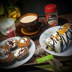 CHOCOLATE CHIP ORANGE SWISS ROLL, CUP CAKES AND MILK COFFEE A picture of CHOCOLATE CHIP ORANGE SWISS ROLL, CUP CAKES AND MILK COFFEE.