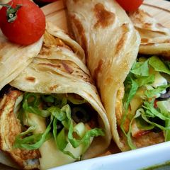 A picture of Chicken tikka egg roll paratha.