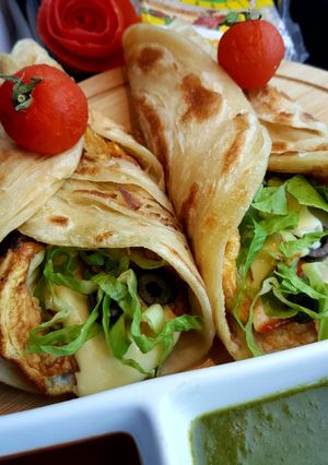 A picture of Chicken tikka egg roll paratha.