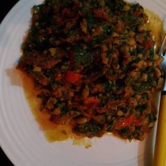 A picture of Beans with tomatoes and vegetable.