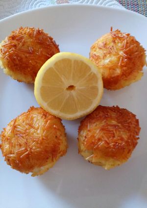 A picture of Angel hair pasta coated fish balls.