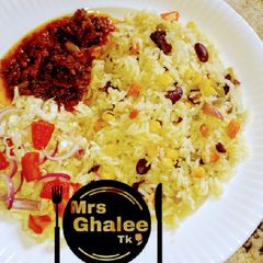 A picture of Veggies rice and stew with salad.