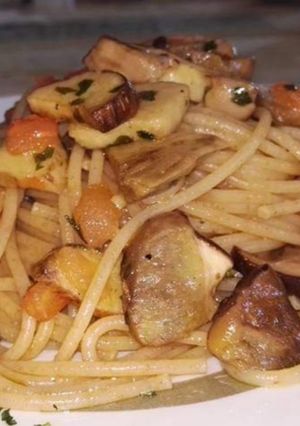 A picture of Spaghetti with Porcini Mushrooms and Fresh Cherry Tomatoes.