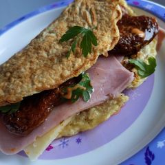 A picture of Ham, cheese and chilli sun-dried tomato Oat omelette wrap.