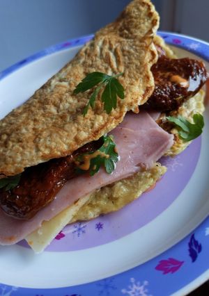 A picture of Ham, cheese and chilli sun-dried tomato Oat omelette wrap.